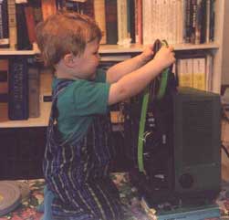 (Picture of
                  Henry trying to load a film on the projector)